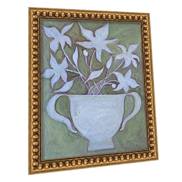Bloom Still Life in Gold — a delicate oil painting capturing soft blooms in a urn. Set against a moss-green background and...