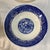The image shows a set of four vintage mid-20th-century Blue Willow cereal or soup bowls featuring the classic Chinoiserie...