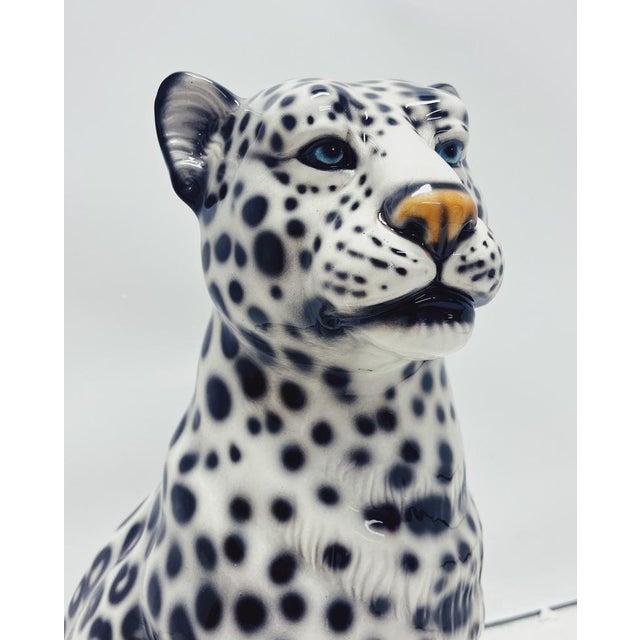 Unique handmade statue of a snow leopard. This Hollywood Regency statue, powerfully made of hand-painted ceramic and made...