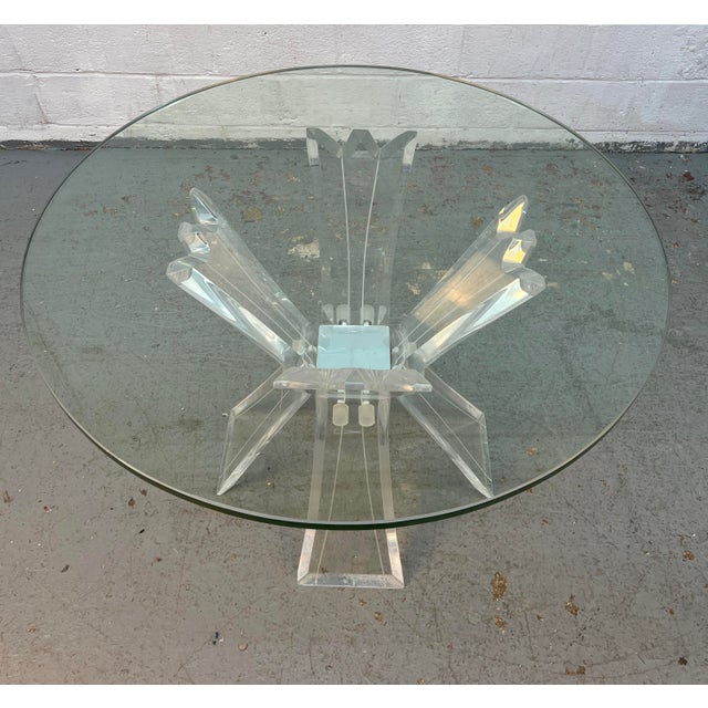 Make a glamorous statement with this Hollywood Regency–style Lucite and glass dining table. Featuring a striking...