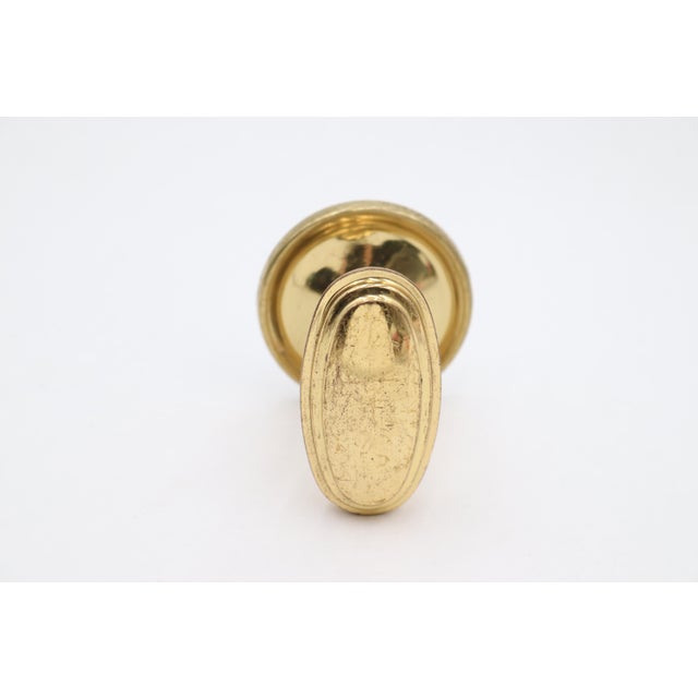 Reclaimed Modern style oval dummy door knob set made of polished brass. The original mounting screws are not available....