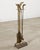 A decorative 20th century equestrian patinated brass fireplace tool set, comprising a stand, shovel, tongs, poker, and...