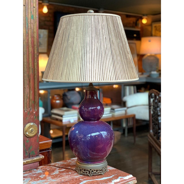 Originally made in the 1930s, this Chinese table lamp is made of a gourd-shaped ceramic vase body with brass base and...