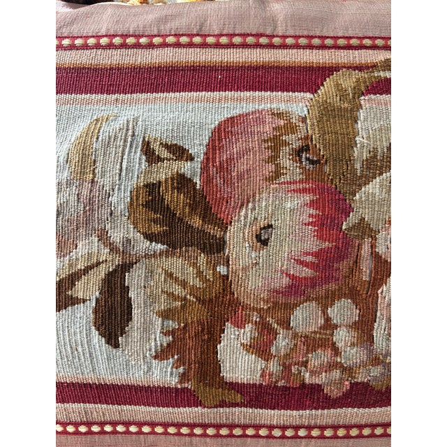 Golden silk pillow with cornucopia tapestry fragment front and silk trim w tassels.