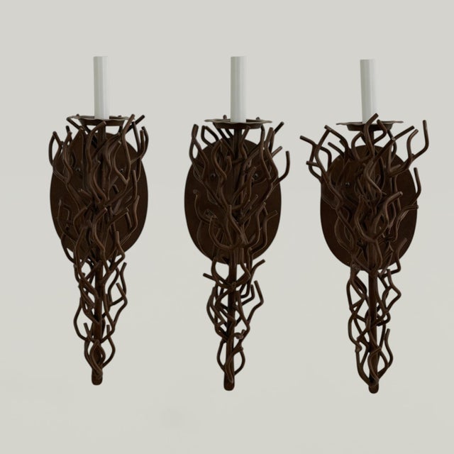 Chic group of three faux coral sconces crafted in bronze in a stylized sculptural form ,labeled on the backs Dana Creath...