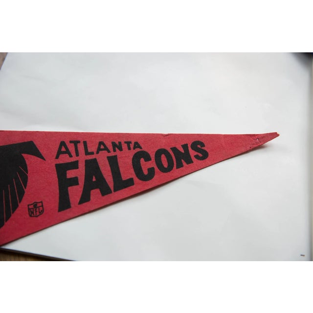 :: Atlanta Falcons team featuring their colors and logo, circa 1970s. In good condition commensurate with age, exhibiting...