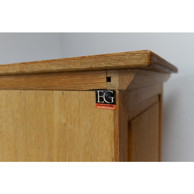 Danish Mid-Century Brutalist Oak Sideboard by Henning Kjærnulf for EG, 1960s. Scandinavian Mid-Century Modern tall...