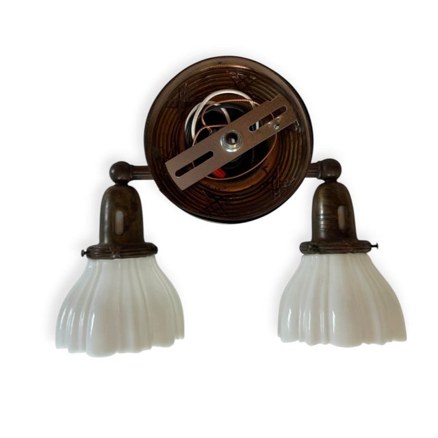 This double wall sconce is perfect over a mirror in a powder room, guest bathroom or even over his and hers in a master...