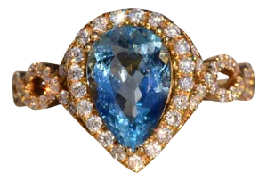 The 30th Avenue: Pear Shaped Aquamarine and Diamond Halo Ring in Yellow Gold
