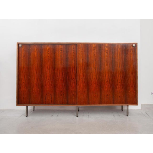 Large high sideboard designed by Alfred Hendrickx for Belform with 2 sliding doors. Sideboard made of a beautiful accent...