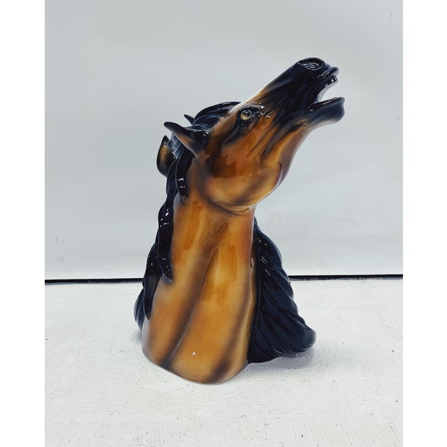 Unique handmade sculpture featuring two horse heads. This Hollywood Regency piece, crafted from hand-painted ceramic and...