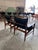 Pair of mid century Swedish sling style lounge chairs, featuring newly upholstered soft black leather, and refinished teak...