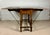 Charming Spanish drop-leaf dining table crafted in wood, dating from the early 20th century. Designed with two hinged...