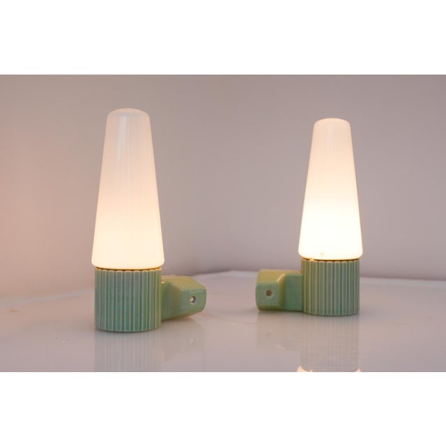 A beautifully preserved pair of mid-century wall sconces designed by hans-agne jakobsson for the iconic swedish lighting...