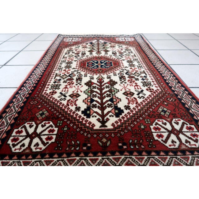 Handmade Vintage Persian Gashkai Rug: Embrace the timeless elegance of our Handmade Vintage Persian Gashkai Rug, a...
