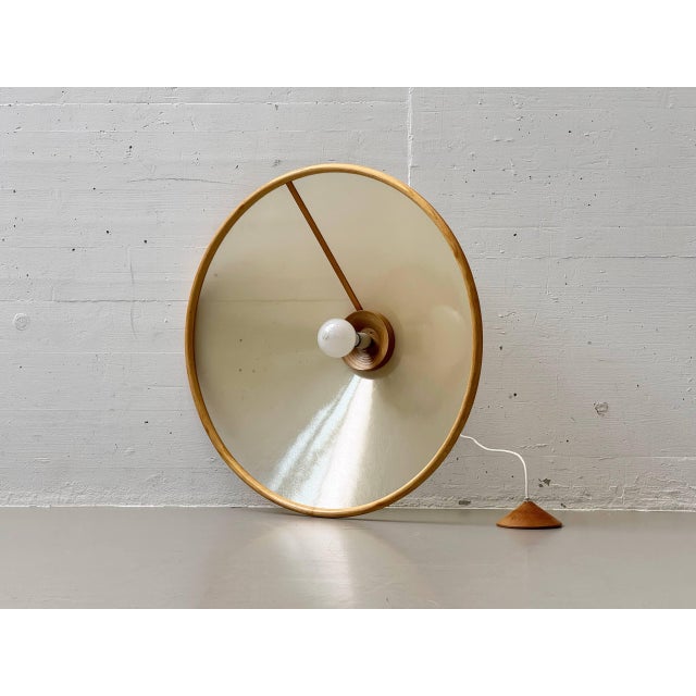 A striking italian ceiling light from the 1970s, designed by giovanni offredi for mc selvini. The light combines a...