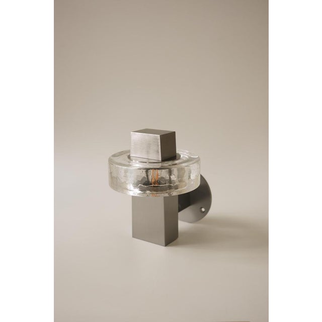 Gioiello ii wall lamp in stainless steel and glass by studio marine breynaert. Dimensions: w 14 x d 17 x h 18 cm....