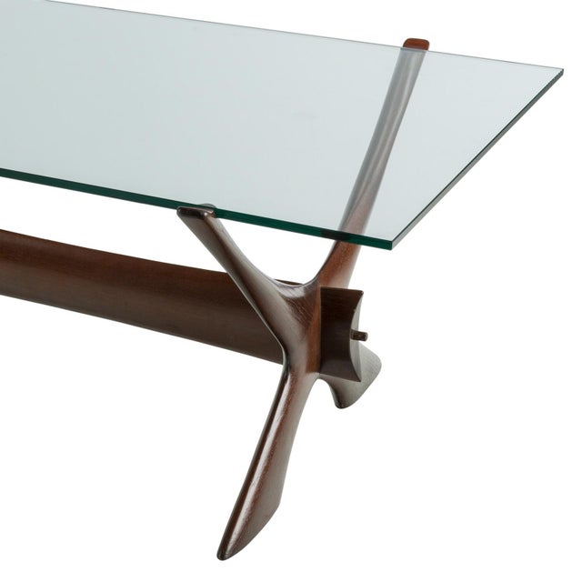 Attributed to Fredrik Schriever-Abeln coffee table with its striking teak wood X-base frame has a wonderful sculptural...
