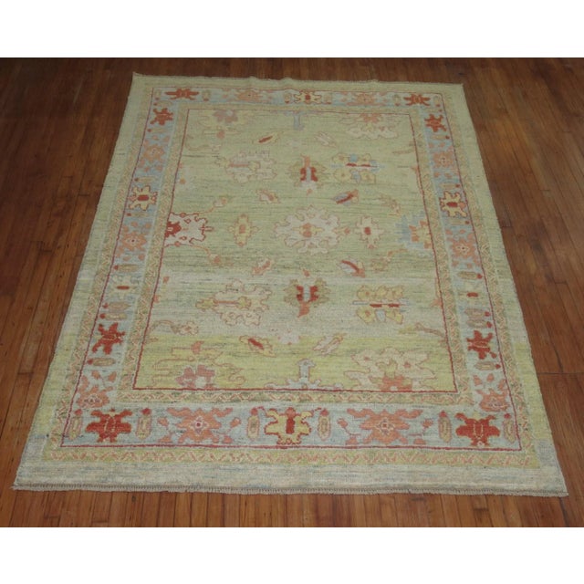 One of a kind Hand-Knotted 100% vegetable Dyed Turkish Oushak in predominantly green.