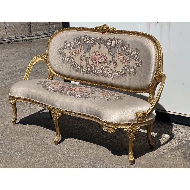 This is a high quality elegant, English settee or sofa in the French Hepplewhite revival or Louis XV style, upholstered in...