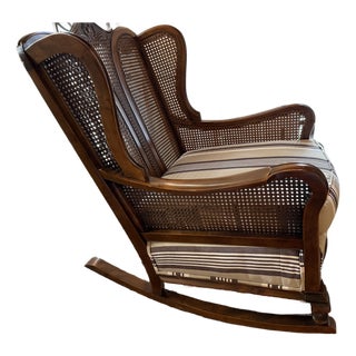 Early 20th Century Wing Back Cane Backed Rocking Chair With New Upholstery For Sale