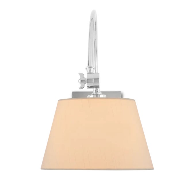 The swing-arm sconce is one of the longest-lasting go-to designs in history. The Ashby Nickel Swing-Arm Sconce is a...
