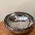 The Handmade Hammered Centerpiece Luna Bowl by Michael Aram from the late 20th century is a stylish and unique piece of...