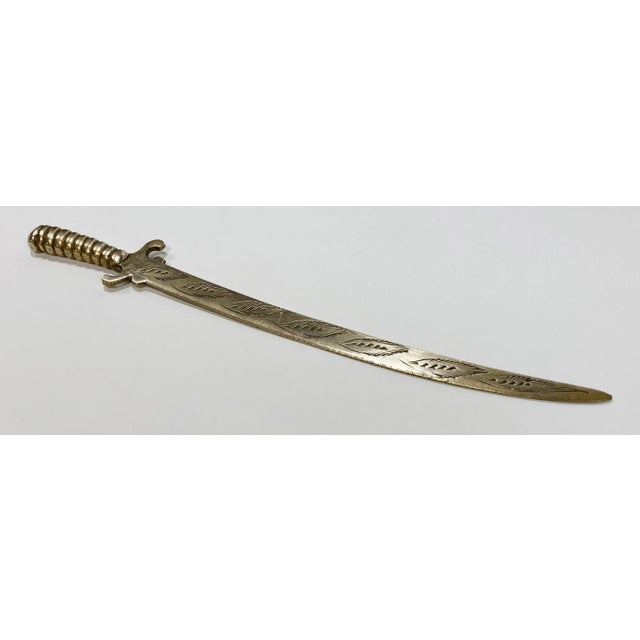 Unique vintage brass letter opener shaped as a Japanese Samurai sword. Marked Sarna Brass and numbered. Great detail to...