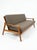 Beautiful vintage grey upholstered sofa featuring clean lines, generous proportions, and elevated tapered legs. The rich...