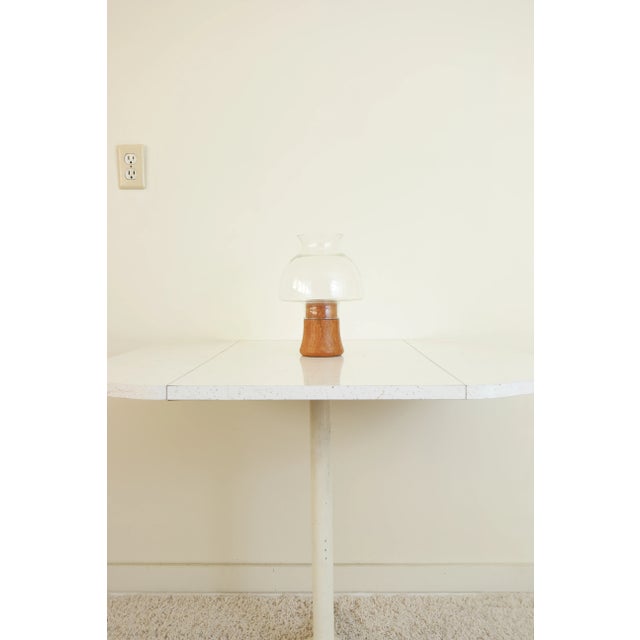 This vintage candle holder is a nice example of Mid Century Modern style. Made by Dolphin, the base is made of brass lined...