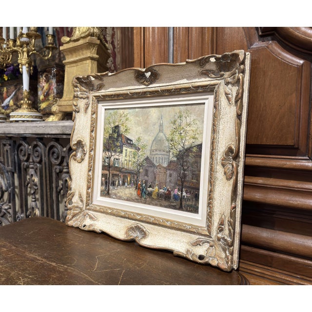 Decorate a den or office with this exquisite Parisian street oil painting. Created in Paris, France circa 1950, this...