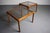 Minimalist design. A set of two teak end tables w/ smoked glass table tops.