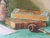 Harmonious watercolor in Greens and Browns from the early 20th C., in the Arts and Crafts style popular in that era....