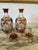 A pair of gorgeous Czech amber cut to clear crystal decanters. Both stoppers in tact with starburst pattern. Bottom of...