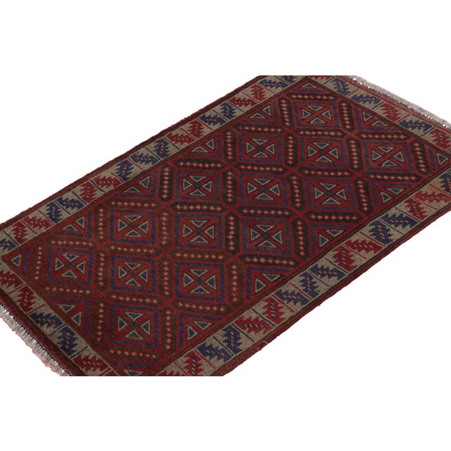 Hand knotted in wool, this 3x4 Baluch scatter rug represents a new line of tribal carpets in the Modern Classics...