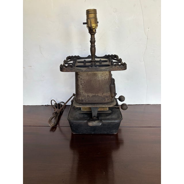 1880s cast iron double-burner kerosene lamp stove now turned into a charming lamp. Manufactured by Florence.