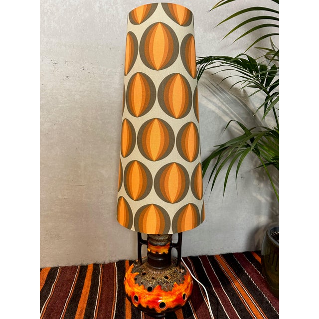Large vintage Fat Lava floor lamp (West Germany) with typical brown and orange colors. 2 light bulbs (E27). Both the...