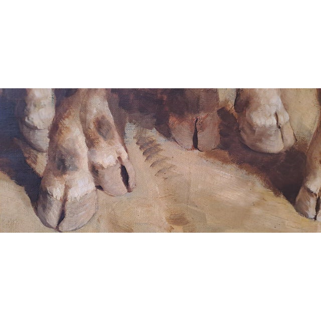 The large painting, framed in a gold frame, depicts a rural scene with traditional elements of agricultural work. In the...