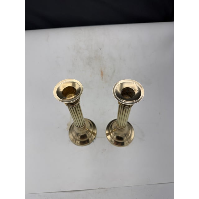 Lovely pair of Brass Candlesticks. The pair features a ribbed column design and have good balance and weight. Great...