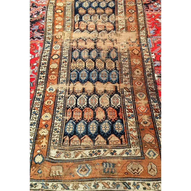 "A rare and deeply personal late 19th century Kurdish runner of extraordinary significance — bearing a woven signature...