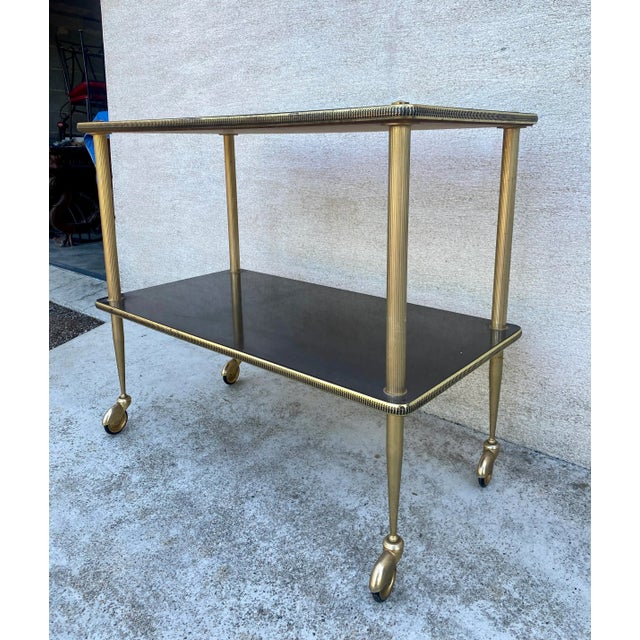 Vintage 1960s serving table, side table on casters, beautiful design, in excellent condition. Dimensions: height 72, width...