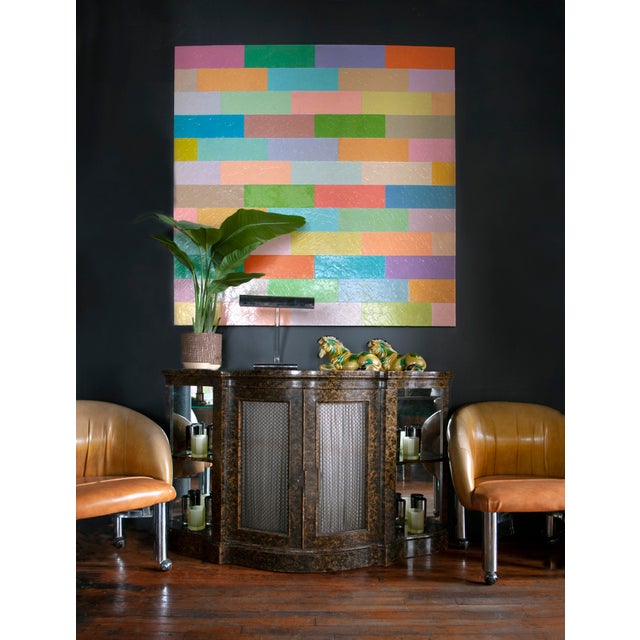 A rhythmic grid of shifting color fields, this painting plays with structure and disruption. Horizontal bands in pastel...