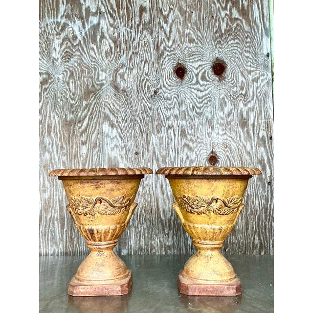 Elevate your shelf, mantel, or garden vignette with this charming pair of vintage Boho-style wrought iron urns. Crafted...