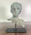 19th century French bronze head of a boy mounted on an iron base. It is a great accent for a side table or bookshelf.