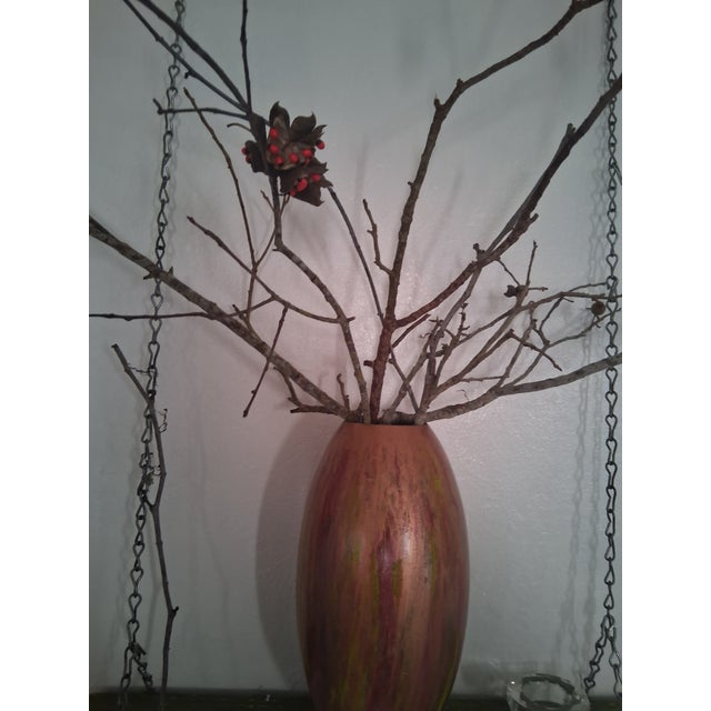 tall, ovoid vessel is a study in vertical motion. Originally a vintage turned-wood vase, it has been reimagined in 2026...