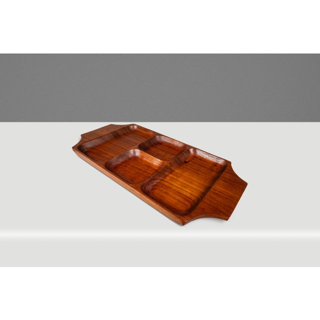 Introducing a quintessentially Organic Modern catch-all tray hand-carved from a solid slab of Burmese teak. Replete with...