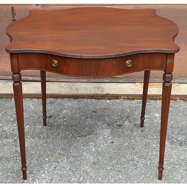 A recently refinished Federal Style Genuine Mahogany Fold-Top Card Table Console Table Measures 36" in with, 36" in depth...