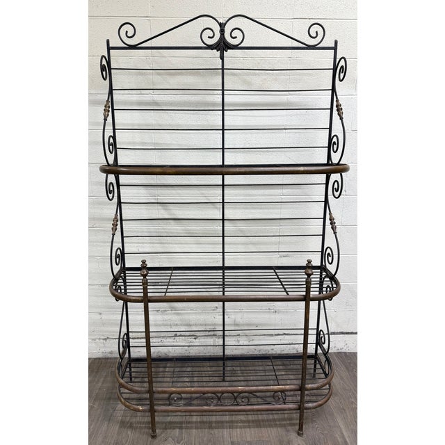 This is a stunning vintage wrought iron and solid brass French Country or Mediterranean style baker’s rack, also known as...