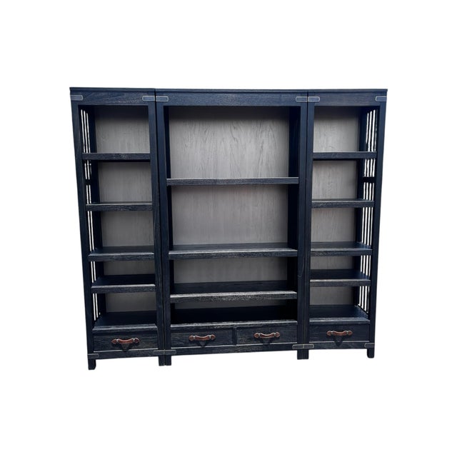A Tremont bookcase by Arhaus. This Rustic style inspired piece is constructed from hardwood with Arhaus’ Dry Branch Black...