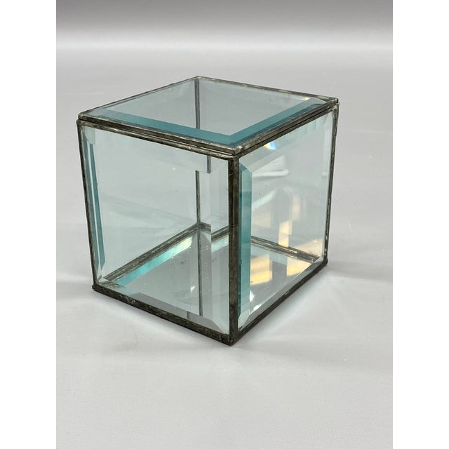 A fine faceted crystal glass panel display cube. Circa 1980-90. The bottom is mirrored glass and the top flips back to...